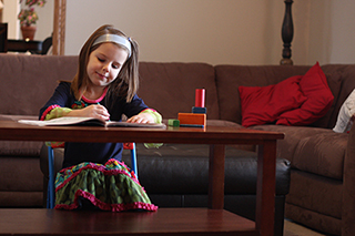 Young girl doing quiet activity