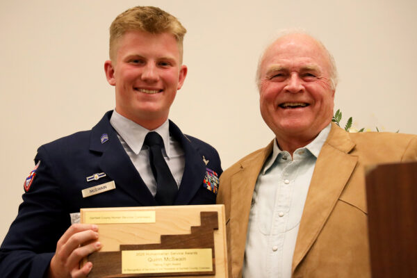Garfield County Commissioner Tom Jankovsky and Garfield County Humanitarian Award winner Quinn McSwain (Taking Flight Award).