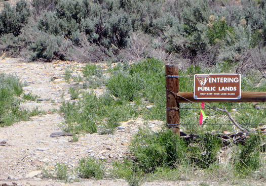 A sign noting that passersby are entering public lands.