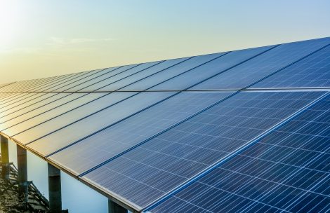 Sunset rays over a photovoltaic power plant.