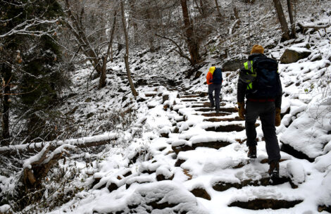 Workers hike the Hanging Lake Trail in Glenwood Canyon in the snow. The popular trail is closed for the winter. (USFS photo)