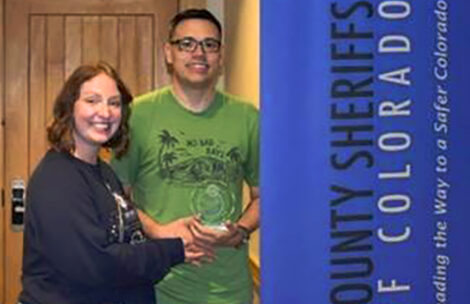 Dr. Adam Ford receives the prestigious Wellness Award at the 2025 Colorado Law Enforcement Coordinators Retreat in Steamboat Springs.