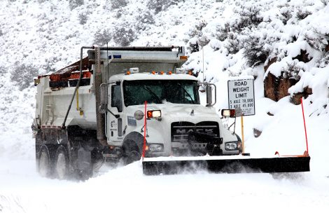 A Garfield County plow clears the road during winter.