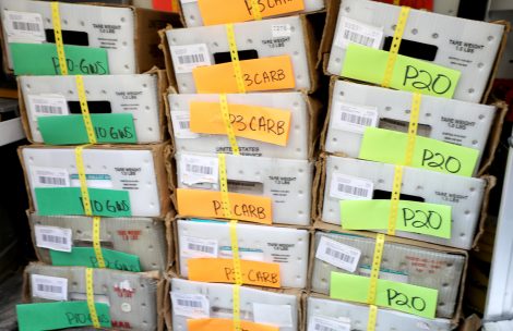 A stack of labeled boxes containing ballots for the 2022 General Election.