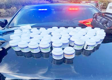 Suspected Hydrocodone is seen on the hood of a Garfield County Sheriff's Office vehicle following a bust on October 18, 2024.