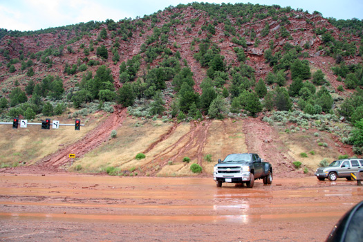 cars turning around in mudslide
