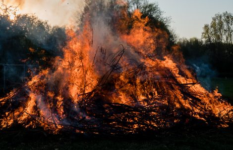 A slash pile is seen burning.