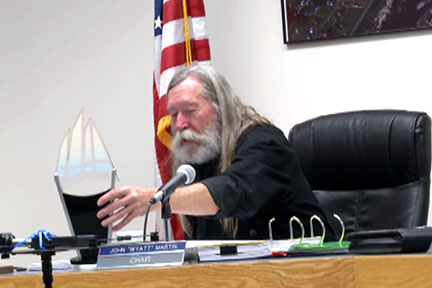 Garfield County Commissioner John Martin displays a state innovation award that was presented to the county's landfill.