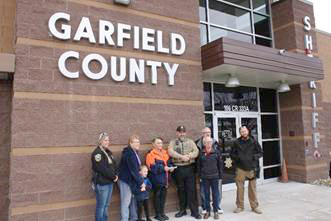 Pictured here are: K-9 Deputy Worley; Loyal Knight Yvonne Kile, with her grandson Isaiah Stewart; Exalted Ruler Pam Bishop; Sergeant Brent Baker; Secretary Russ Guerette, with his wife Connie; as well as K-9 Deputy Korthals.