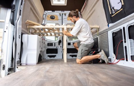 A man is converting a van into a caravan.