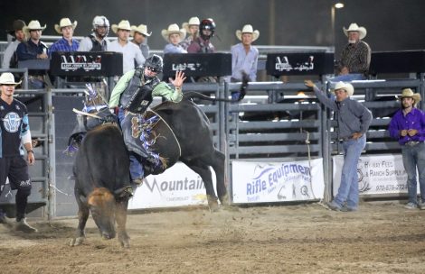 A contestant rides a bull at the 2023 Garfield County Fair and Rodeo in Rifle, Colorado.