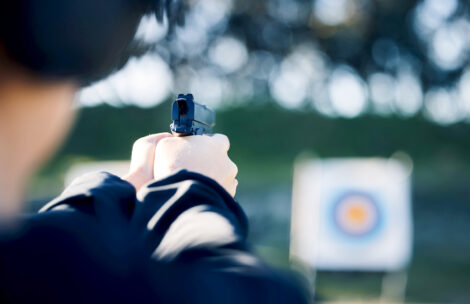 A person training outdoors at shooting range for game exercise or sports challenge.