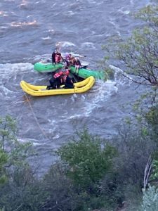 Rafters are stranded on a rock in the Roaring Fork River near Glenwood Springs on Tuesday, May 17, 2022.
