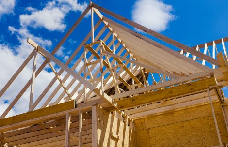 Wooden beams as part of the construction of a roof framing truss system.