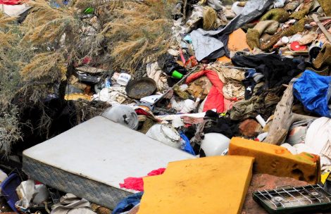 Trash on the ground in Glenwood Springs from a homeless camp.