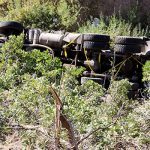 Garbage truck rolls down embankment in South Canyon