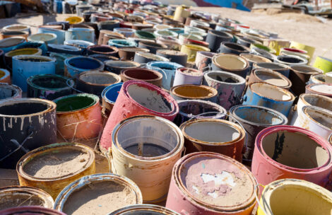 A group of colorful paint cans.