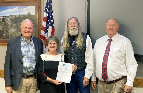 The Garfield County Board of County Commissioners pose with Linda Morcom at a recent meeting.