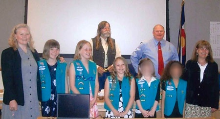 Kids who made cloth shopping bags standing with the Garfield County Commissioners.