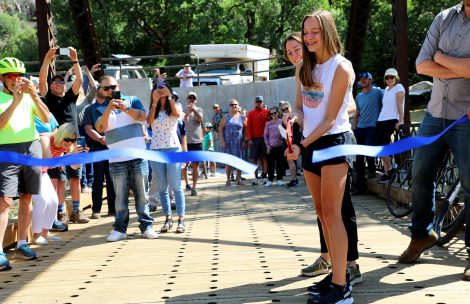 Jane Taylor, daughter of Janis and Rod Taylor, cuts a ribbon on the Hardwick Bridge officially opening the Hardwick Bridge Trail south of Glenwood Springs.