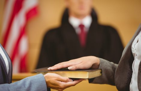 hands on book during swearing in ceremony