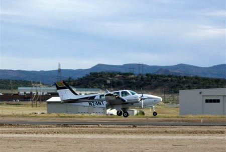 A prop plane takes off at the Rifle Garfield County Airport.