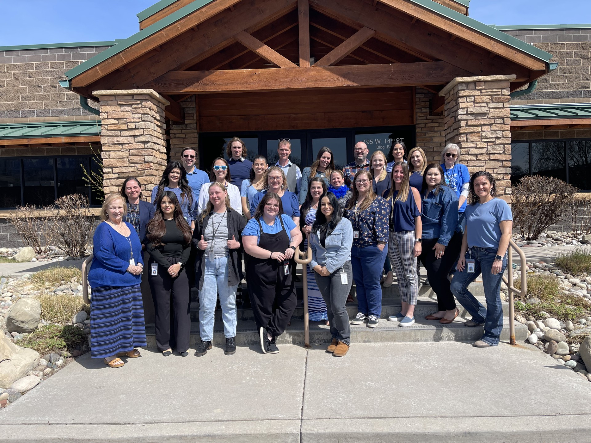 DHS Child welfare staff outside the front of their building
