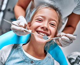 Child smiling at dentist office