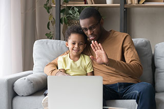adult and child on video call