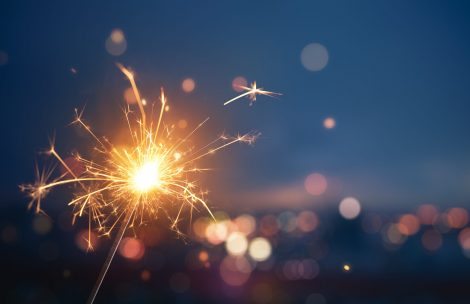 Sparkler fireworks against evening background.